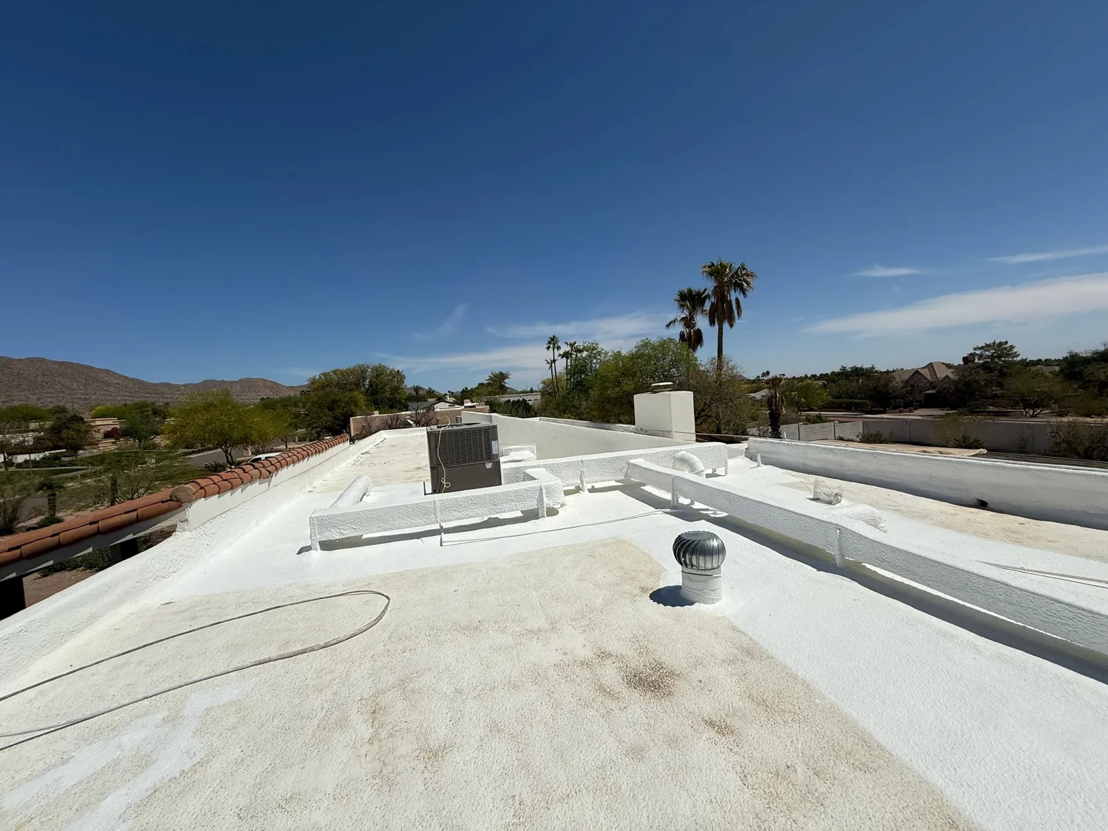Coated flat roof after roof maintenance in Arizona